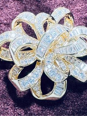 Elegant Gold-Tone Bow Brooch with Clear Crystal Accents